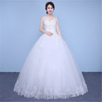 White wedding dress with lace details on a blue background