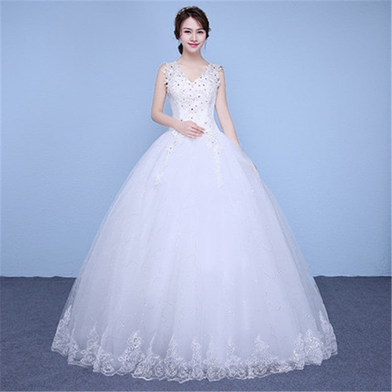 White wedding dress with lace details on a blue background