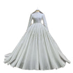 White wedding dress with long sleeves on a white background