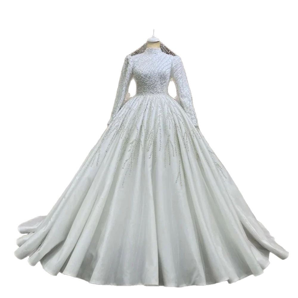 White wedding dress with long sleeves on a white background