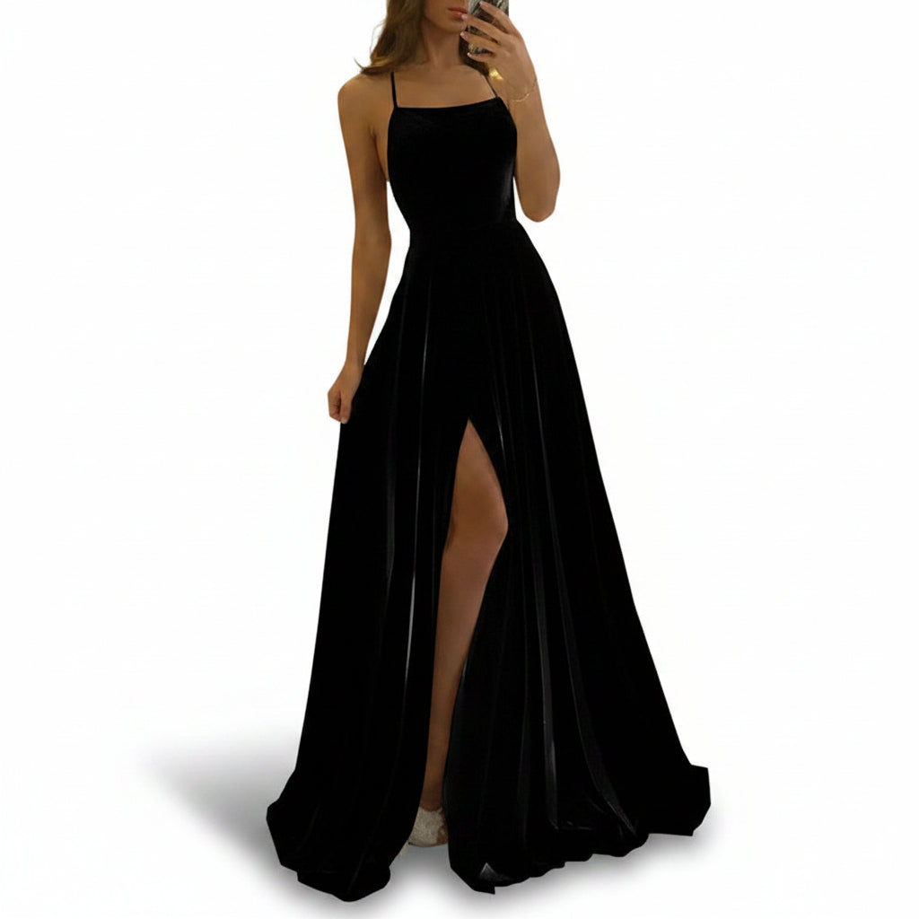 Person wearing a black dress with a high slit in a store setting