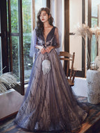 Woman in a elegant dress standing indoors with decorative elements.