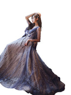 Woman in a long, dark blue evening gown on a white background