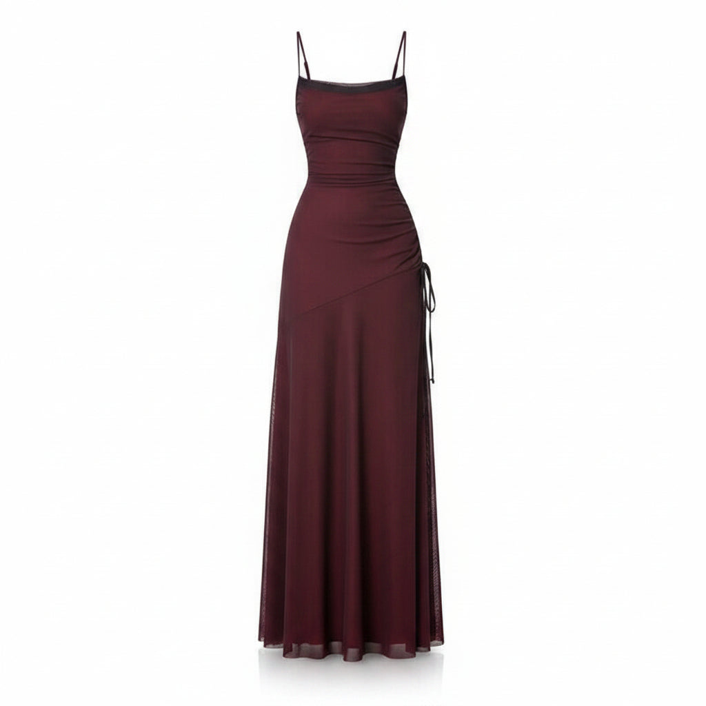 Burgundy evening gown with a slit on a white background