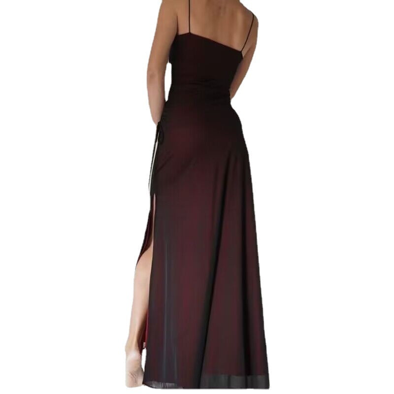 Long dark red evening gown with thin straps and a slit on a white background