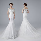 White wedding dress with lace details on a dark background