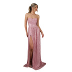 Pink strapless evening gown with a high slit on a white background