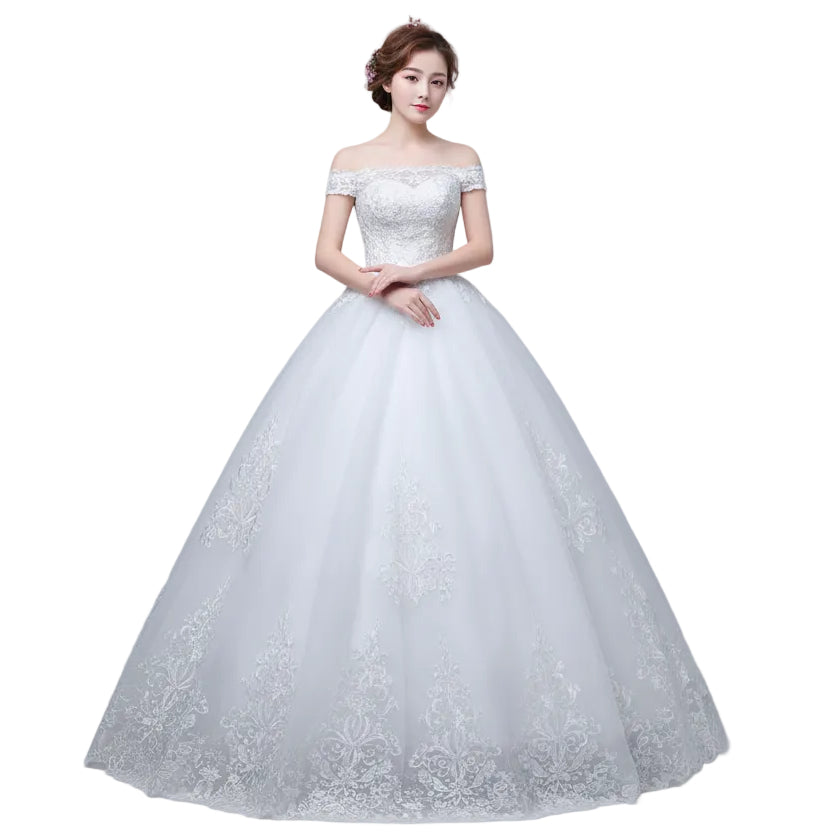 White wedding dress with lace details on a plain background