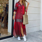 Woman wearing a red plaid dress with white sneakers and a straw bag, standing outside a store.