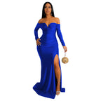 Woman wearing a blue off-shoulder gown with a slit on a white background